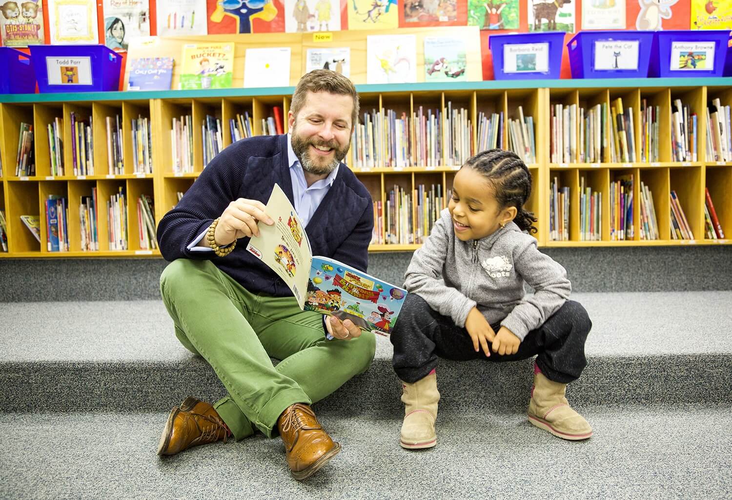 Michael Tamblyn reading with child