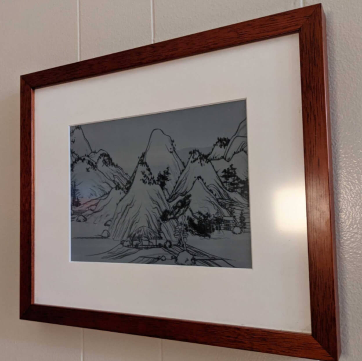 e ink picture frame showing scrolling landscape