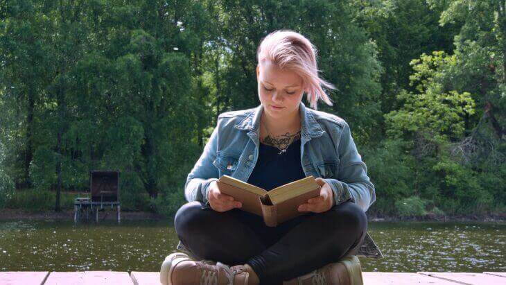 young girl reading book large