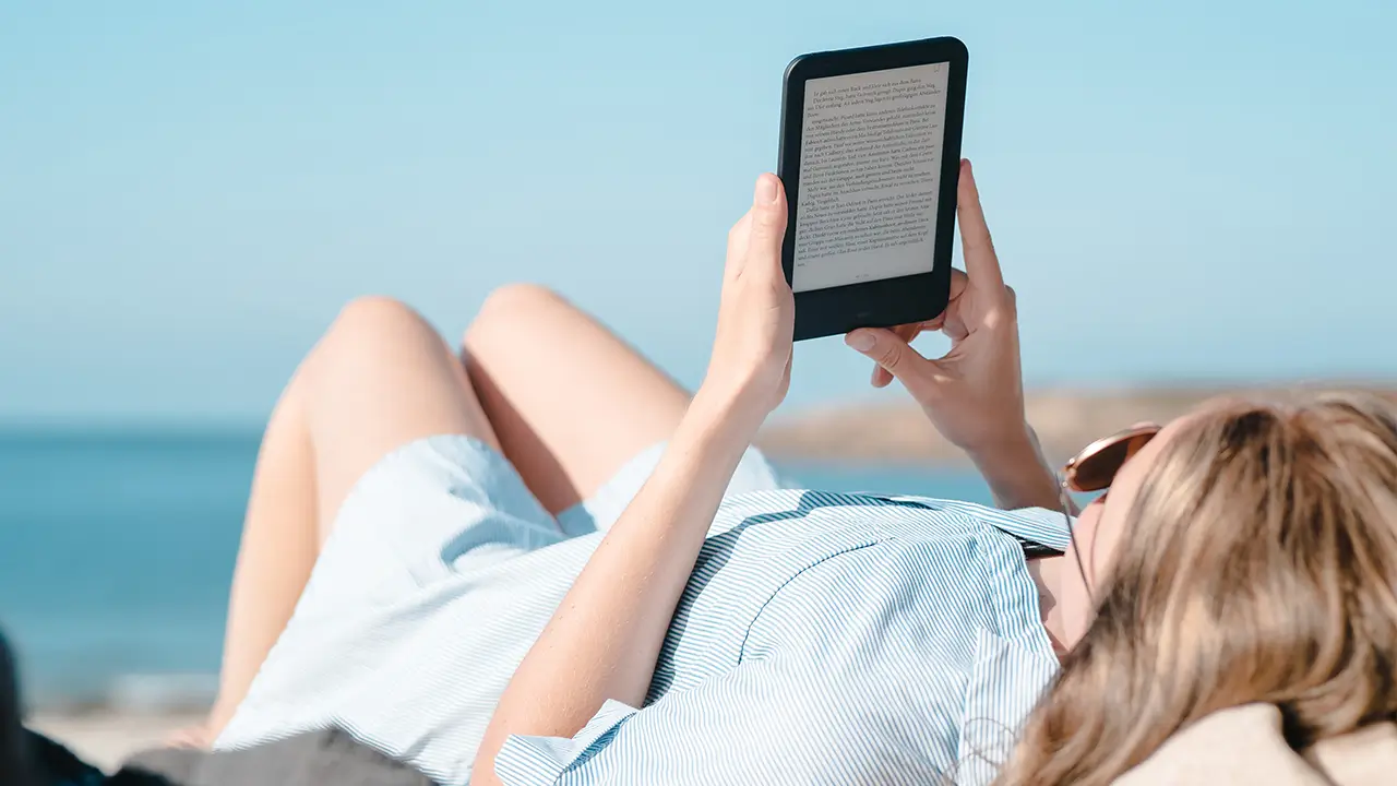 woman reading kindle adobe